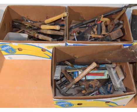 Three boxes containing an assortment of tools including planes, saws, spanners etc 