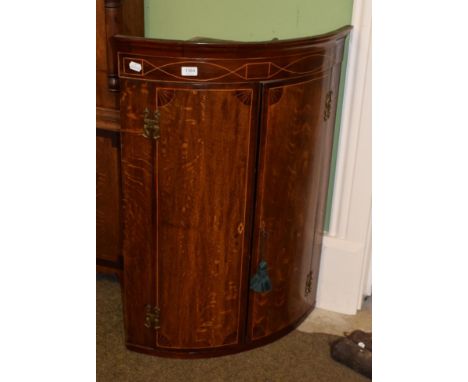 George III oak and mahogany cross-banded bow fronted hanging corner cupboard 