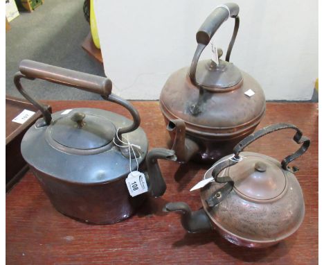 Three vintage copper kettles, one with iron handle. (3)(B.P. 21% + VAT) 