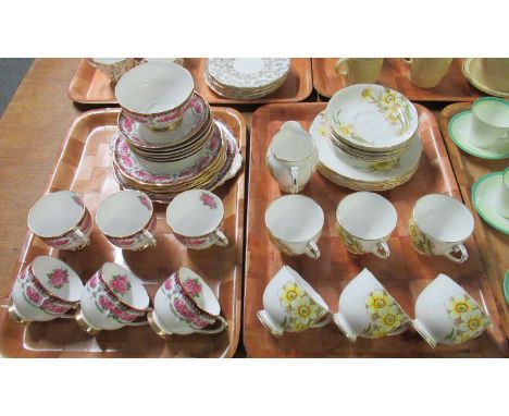 A tray of Roslyn bone china 'Nancy' decorated with narcissi or daffodils and fronds on a white ground to include: six cups an