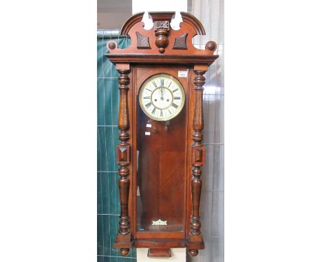 Early 20th century walnut Vienna type two train wall clock with key, pendulum, and weights.(B.P. 21% + VAT) 