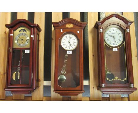 Three modern wall clocks to include; an Edwardian style marked 'London Clock Company', an Emperor quartz Westminster chime cl