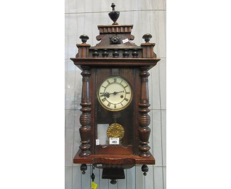 Early 20th century walnut two-train Vienna type wall clock with key and pendulum.(B.P. 21% + VAT) 