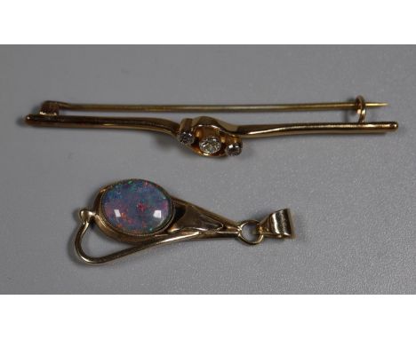 Three stone diamond bar brooch and an opal pendant. (B.P. 21% + VAT)&nbsp;Brooch is 18ct gold, opal pendant is 9ct gold.