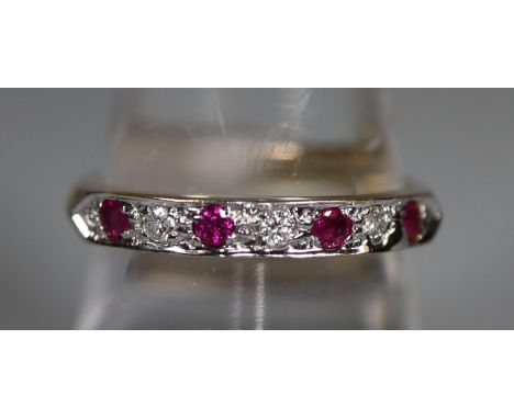 9ct gold ruby and diamond half eternity style ring.  Ring size P.  Approx weight 2.5 grams.(B.P. 21% + VAT) 