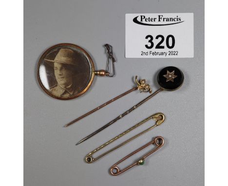 9ct gold photograph locket and a collection of stick pins.(B.P. 21% + VAT) 