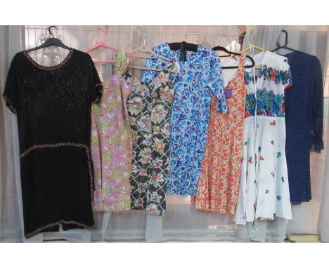 Seven vintage and vintage style dresses to include; a lace long sleeve dress (missing underslip), various floral print dresse