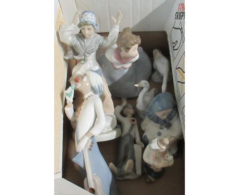 Box of porcelain figurines to include: four Spanish Cascades figurines, three clowns and one pierrot style boy, together with