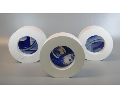 Three unusual modern art/stained glass blue and white abstract panels of circular form within a white circular frame. Indisti