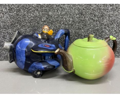 A vintage Carlton ware apple teapot with a vintage Carlton ware aeroplane teapot