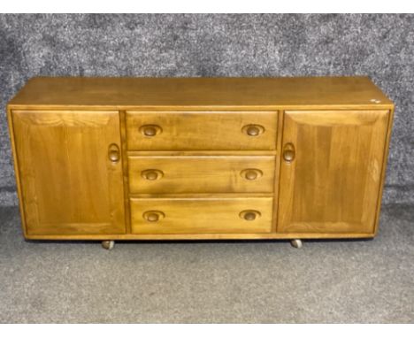 Ercol (blonde) low sideboard fitted with 3 drawers &amp; 2x shoulder cupboards, 155x43.5cm, height 68.5cm