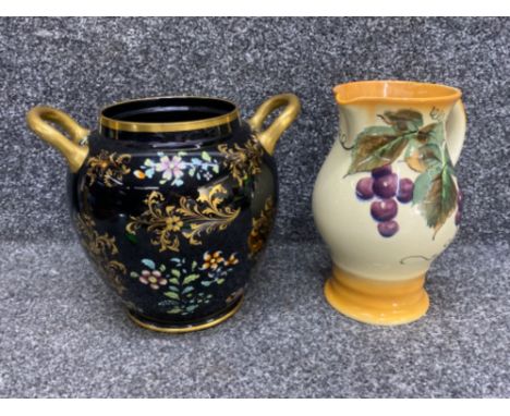 A large twin handled vintage pot. Hand painted with Gilt decorated and a vintage royal Doulton jug with grapes and vine decor