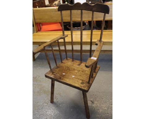 Welsh primitive style stick back armchair on moulded seat and tapering legs. (B.P. 21% + VAT) 