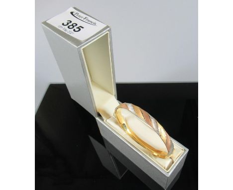 9ct three colour gold bangle.  Approx weight 7.8 grams.(B.P. 21% + VAT) 