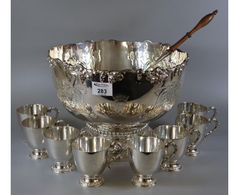 Sterling silver punch bowl set comprising punchbowl with ladle, and a set of eight cups, by Garrard to commemorate the silver