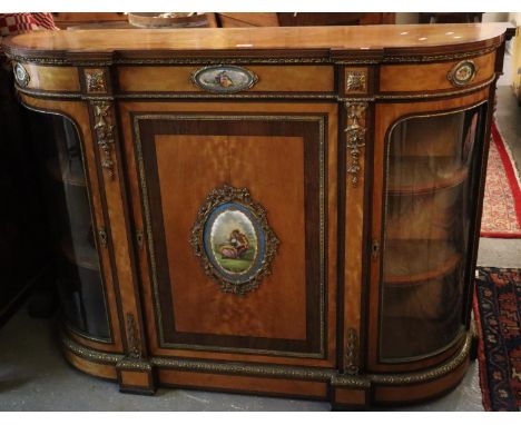 Victorian satin and mixed woods Credenza, the shaped top above three oval porcelain painted panels of figures and flowers wit