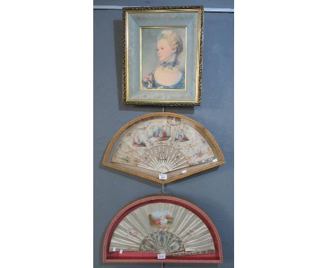 Two similar hand painted mother of pearl fans in glazed cases, both with figural and floral decoration, 60cm wide approx, tog