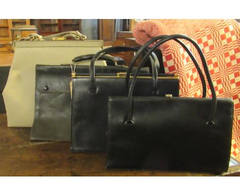 Four leather vintage bags to include; a taupe large ladies handbag with Fassbender made in England label, a textured black la