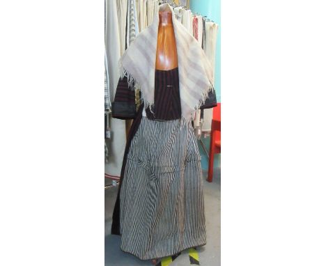 19th Century traditional woollen Welsh costume to include; a white and black striped petticoat skirt, a black and red striped