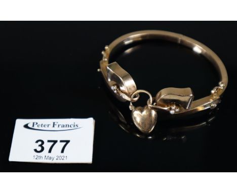 Victorian yellow metal Heart bangle set with seed pearls. Approx weight 10.2 grams. (B.P. 21% + VAT)Possible repair to one si