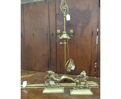 Four items: a copper and brass conversion to a three bulbed electric lamp, a set of brass stair rods and two brass hearth dec