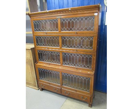 Early 20th Century oak presentation Globe Wernicke style lead glazed four section bookcase, the presentation plaque dated 193