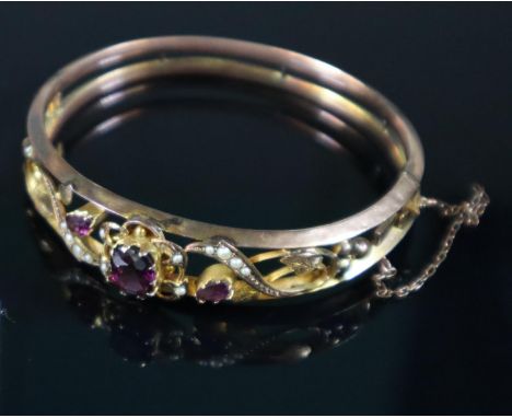 Victorian 9ct gold amethyst and seed pearl bangle. Approx weight 10.8 grams. (B.P. 21% + VAT) Minor wear and dinks  but compl