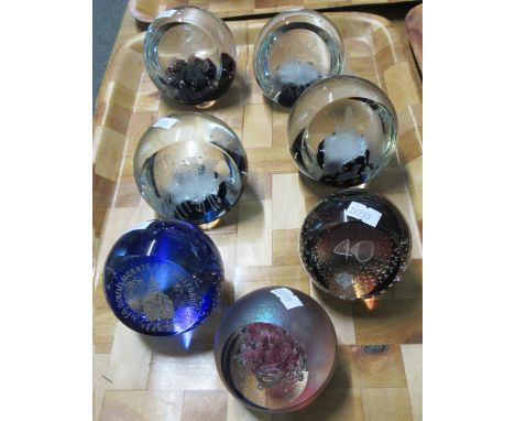 Tray of assorted glass paperweights to include; three Caithness with nativity scenes, commemorative 80th birthday of HM Queen