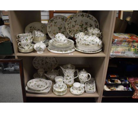 An extensive collection of Wedgwood 'Wild Strawberry' comprising; cups, saucers, plates, bowls, coffee pot, platters and more