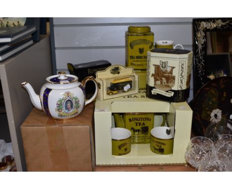 An assorted collection of Ringtons collectables, including a Heritage tea set, a diecast model van, and a commemorative Queen