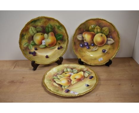 Three hand painted Coalport plates, signed by R Dale, A Baggott and Joseph Motram.