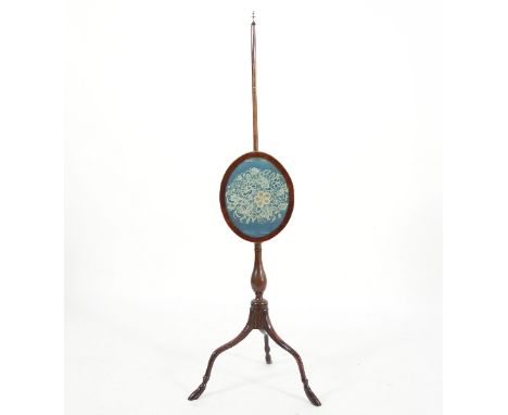 A mahogany pole screen with tripod support on hoof feet, set a 19th Century oval frame, 125cm high