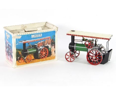 A Mamod engine, two train sets and a boat