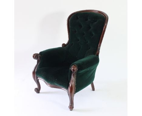 A 19th Century mahogany framed button back armchair with scrolling cabriole legs and deep green velvet upholstery