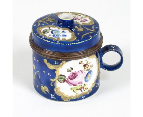 A Bilston enamel drum-shaped bougie-box, circa 1775, with funnel-topped cover, ring handle and painted with floral reserves w
