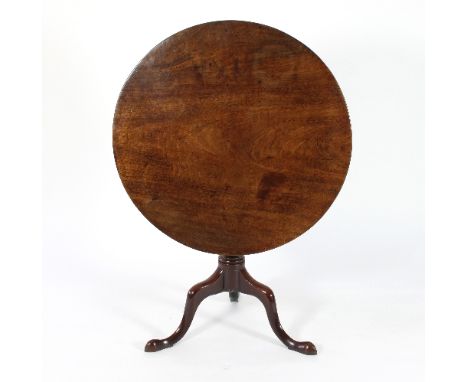 A George III mahogany supper table, the circular top on a turned baluster column and tripod base, 82.5cm diameter Condition R