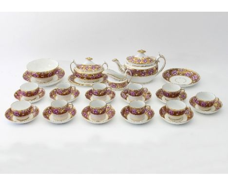 A 19th Century Spode tea service decorated with purple flowers within gilt floral bands, comprising a teapot, twin-handled su