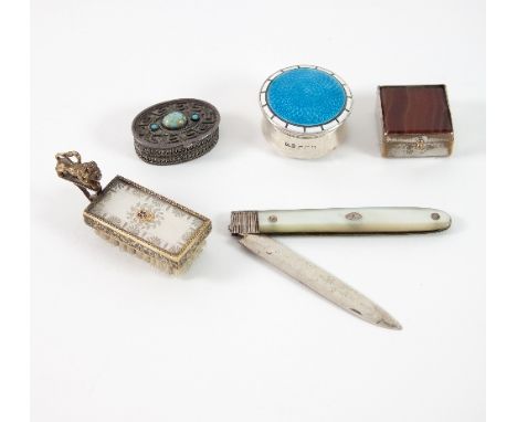 A circular silver pill box with blue enamel cover, marks rubbed, 3.5cm diameter, a mother-of-pearl handled penknife, a gilt m