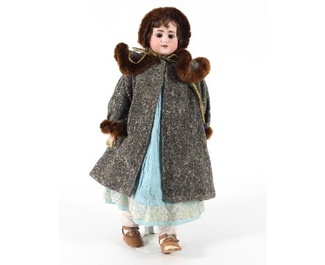 An early 20th Century German bisque head doll, open mouth and sleeping eyes, composition body in original costume, shoes and 