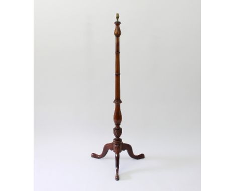 A turned wood standard lamp on a tripod support, 176cm high