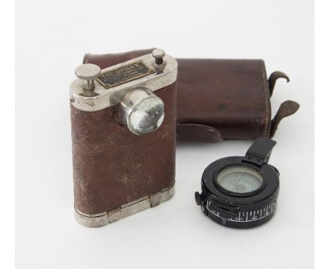 A WWI torch The Orilux, JH Steward Ltd., London, in a leather case and a compass by TG & Co. Ltd 1941
