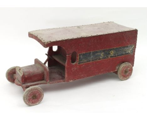 A wooden post van, painted red and initialled G R, 64cm long