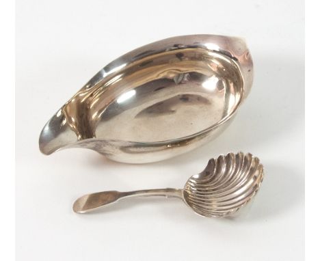 A Scottish silver caddy spoon, AB, Edinburgh 1835, with shell bowl and a George III pap boat, marks rubbed