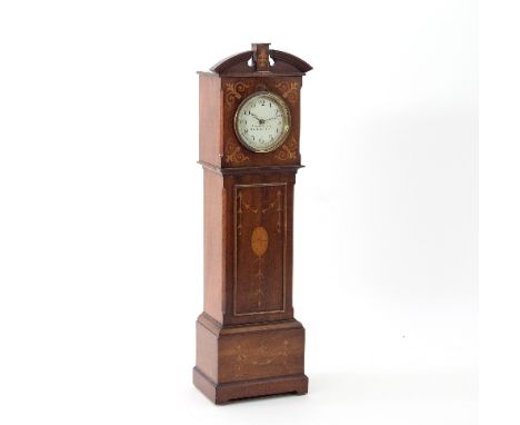 A miniature inlaid cased longcase clock, the circular dial with Arabic numerals, signed Houghton & Gunn, 162 N Bond St, Londo