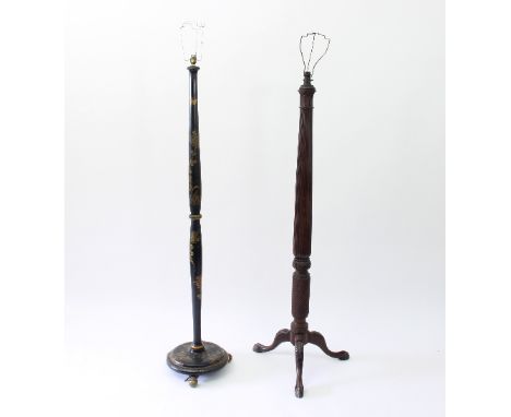 A turned wood standard lamp on a tripod support, 183cm high and a lacquered standard lamp