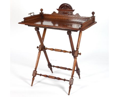 A mahogany butlers tray, circa 1900, with twin brass handles on a folding turned X-frame stand/see illustration Condition Rep
