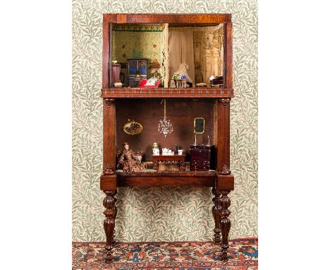 'The Rosewood House', an unusual English rosewood cabinet dolls house, 19th Century, the two-storey dwelling supported on ela