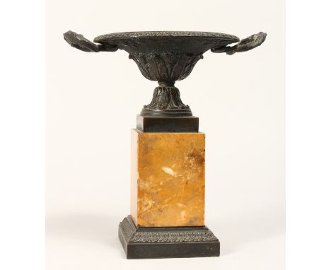 A REGENCY BRONZE TWO HANDLED CIRCULAR TAZZA on a marble plinth 9ins high.