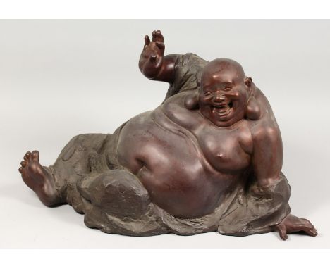 A LARGE BRONZE BUDDHA FIGURE. 25ins long.