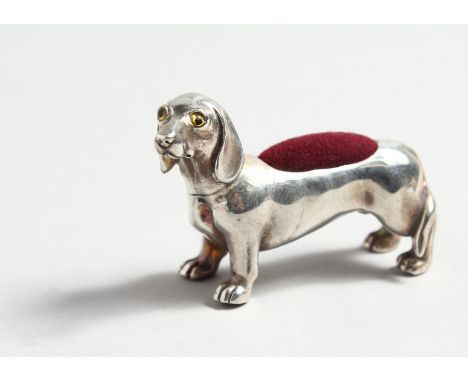 TWO SILVER DACHSHUND PINCUSHIONS.